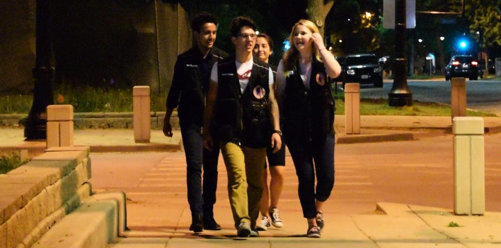 SafeWalks escorts walking with students on campus